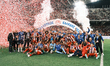 Olympiacos players and team personnel celebrate with the trophy following the Greek Cup Fi...