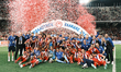 Olympiacos players and team personnel celebrate with the trophy following the Greek Cup Fi...