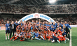 Olympiacos players and team personnel celebrate with the trophy following the Greek Cup Fi...