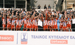 Olympiacos players and team president Vangelis Marinakis raise the trophy following the Gr...