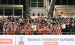 Olympiacos players and team president Vangelis Marinakis raise the trophy following the Gr...