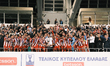 Olympiacos players and team president Vangelis Marinakis raise the trophy following the Gr...
