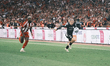 OFI's Thiago Nuss (right) is challenged by Olympiacos' Christos Mouzakitis (left) during t...