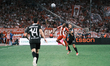 Olympiacos' Gelson Martins (left) is challenged by OFI's Vassilis Lampropoulos (right) dur...
