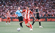Olympiacos' Santiago Hezze (center) participates in the Greek Cup Final soccer match again...
