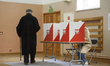 People vote at a polling station during presidential elections in Warsaw, Poland, on May 1...