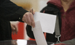 People cast their ballots at a polling station during presidential elections in Warsaw, Po...