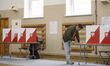 People vote at a polling station during presidential elections in Warsaw, Poland, on May 1...