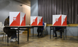 People vote at a polling station during presidential elections in Warsaw, Poland, on May 1...