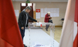 A man casts his ballot at a polling station during presidential elections in Warsaw, Polan...