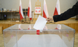 A man casts his ballot at a polling station during presidential elections in Warsaw, Polan...