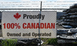 EDMONTON, CANADA, MAY 24:Close-up of a 'Proudly 100% Canadian Owned and Operated' poster...