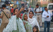 Indian tourists take pictures near the Clock Tower (Ghanta Ghar) in Srinagar, Jammu and Ka...