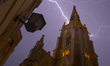 Lightning and rain occur during a thunderstorm over the Catholic Church of Mary in Novi Sa...