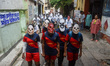 Children dress in skeleton costumes during an awareness rally organized by a social organi...
