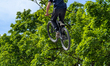 A BMX rider performs a mid-air backflip during a stunt show in Munich, Germany, on June 1,...