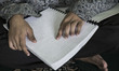 A Blind Man reading Alquran Braille. As Ramadhan Fasting for moeslim people approaching th...