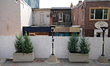 Protective construction boards are put up along a section of buildings on Main Street in B...