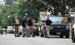 A major law enforcement operation and presence follow the discovery of a man, woman, and c...