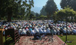 Kashmiri Muslims offer Eid al-Adha prayers at the Mughal garden in Srinagar, Jammu and Kas...