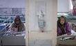 Two elderly Iranian women sit in their beds at Kahrizak charity nursing home in southern T...