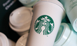 Starbucks logo is seen on a coffee cup at the cafe table in Krakow, Poland on June 8, 2025...