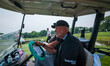 Darren Clarke drives a golf cart in Madison, Wisconsin, on June 8, as Steve Stricker looks...
