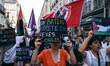 In Rennes, France, on June 9, 2025, demonstrators hold up a sign against the genocide in G...