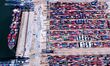 A cargo ship loads and unloads foreign trade containers at Qingdao Port in Qingdao City, S...