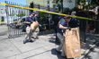 Eight New York City Police Department vehicles are set on fire in a parking lot at Central...