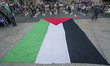 A huge Palestinian flag is deployed in the main square of the city of Santander during a d...