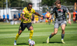 Lisandro Semedo and Maksymilian Tkocz play during the game between Wieczysta Krakow and Ch...