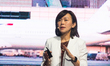 Anna Yip, CEO of International Digital of Singapore Telecommunications, is on the stage of...