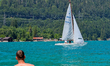 A man cools off in the clear waters of Lake Walchensee in Walchensee, Bad Toelz-Wolfratsha...