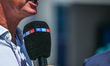MONTREAL, CANADA JUNE 15: A journalist speaks to a microphone displaying the RTL logo dur...