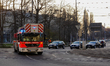 A fire engine of the Leipzig Fire Department (Feuerwehr Leipzig) drives through city traff...