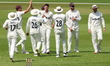 Matthew Fisher of Surrey celebrates the wicket of Will Rhodes of Durham during the Rothesa...