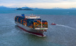 A super-large container ship prepares to berth at the container terminal of Yangshan Deepw...