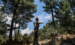 Indian soldiers of the Border Security Forces (BSF) patrol near the entry point towards Ba...