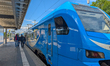 Young passengers board an Arverio regional train at Memmingen station in Memmingen, Swabia...