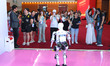 Visitors interact with a robot at the 3rd China International Supply Chain Expo in Beijing...