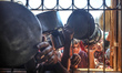 Palestinians queue for a portion of hot food distributed by a charity kitchen in Gaza City...