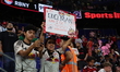 Fans hold up signs during the Major League Soccer match between Inter Miami CF and New Yor...