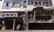 A man examines an apartment in the Shevchenkivskyi district that catches fire during a Rus...