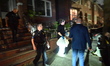 Members of the New York City Police Department crime scene unit take photographs and gathe...