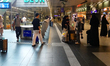 Train passengers are in the station hall of Berlin Main Station in Berlin, Germany, on Jul...