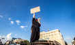 A demonstrator in Kharkiv, Ukraine, stands on top of a car with a medical badge to protest...