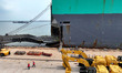 A roll-on/roll-off vessel loads export excavators at the berth of Lianyungang Port in Lian...