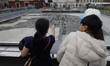 Tourists visit the vicinity of the Templo Mayor in Mexico City's Zocalo, on July 25, 2025,...