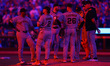 San Francisco Giants Manager Bob Melvin stands on the mound with players during a pitching...